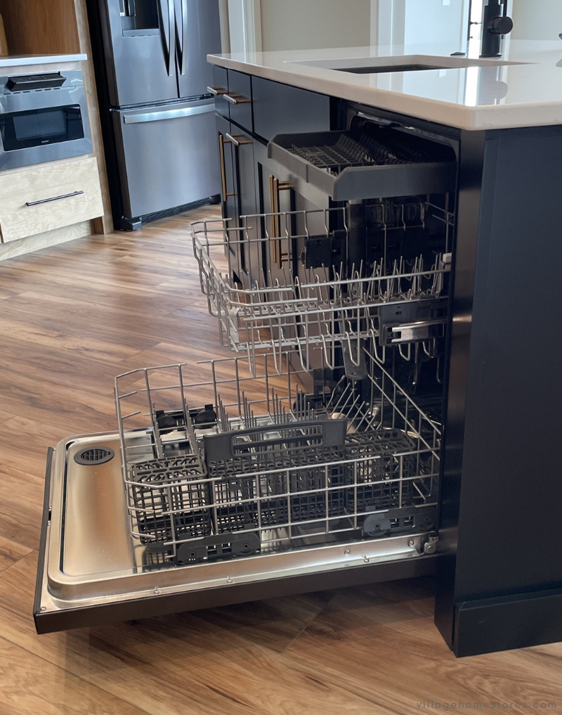 whirlpool dishwasher installed in island shown with door open racks pulled out