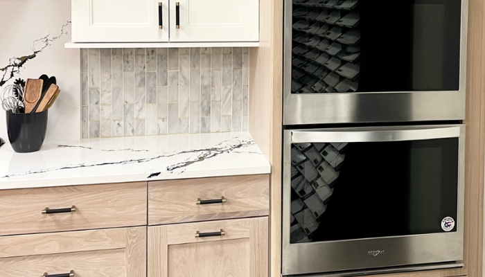 wynnbrooke white oak cabinet in sand finish with double wall oven installed