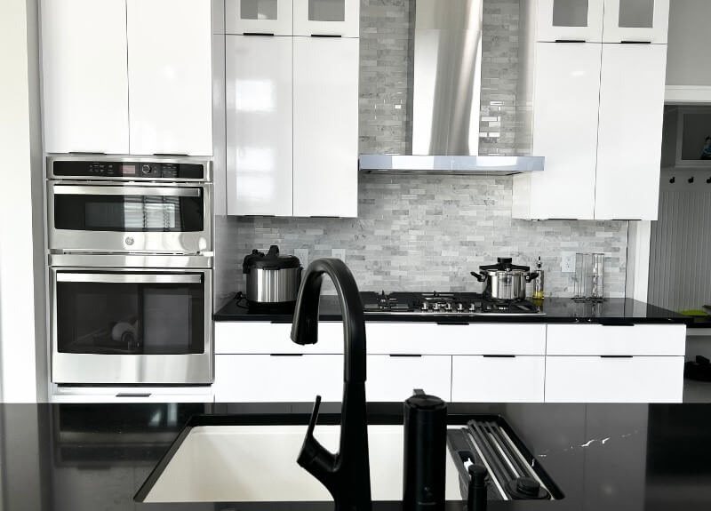 village home stores kitchen design in black and white colors