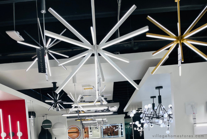 led firework shaped lighting in black white and brass finishes.