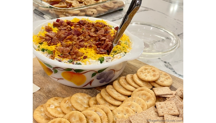 dish with jalapeno cheese ball dip and plate of crackers