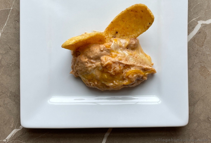 Texas bean dip and chips on white plate