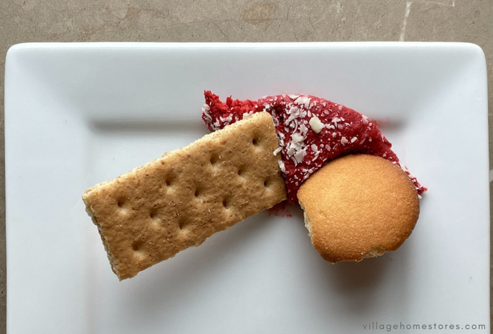 red velvet cake dip with graham cracker and nilla wafer on white plate