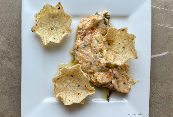spinach ranch dip on white plate with chips