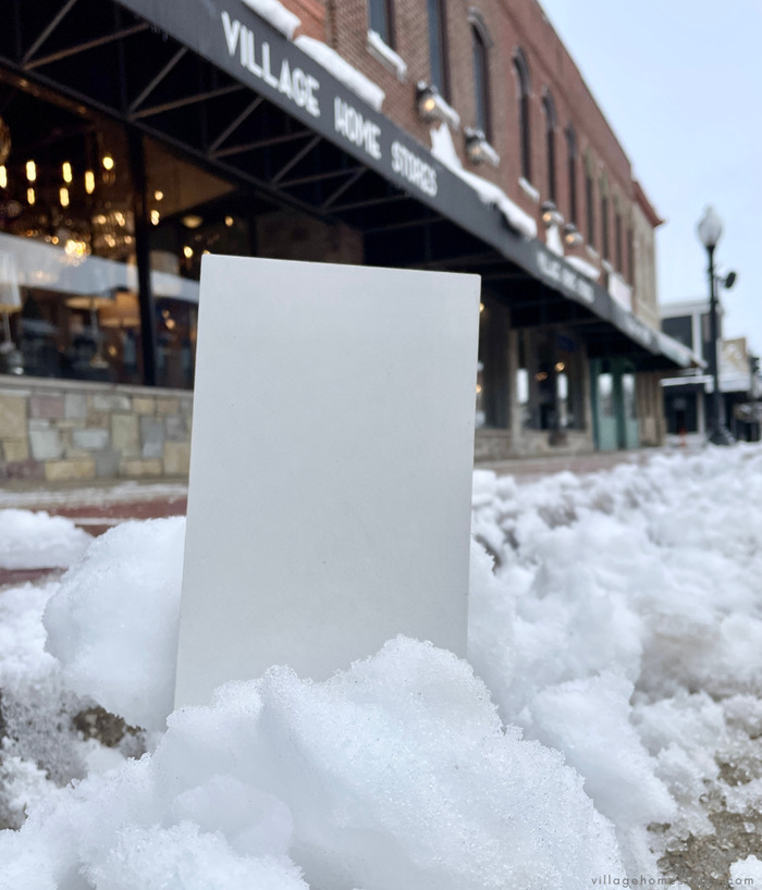 Arctic white quartz sample in snow drift outside of Village Home Stores