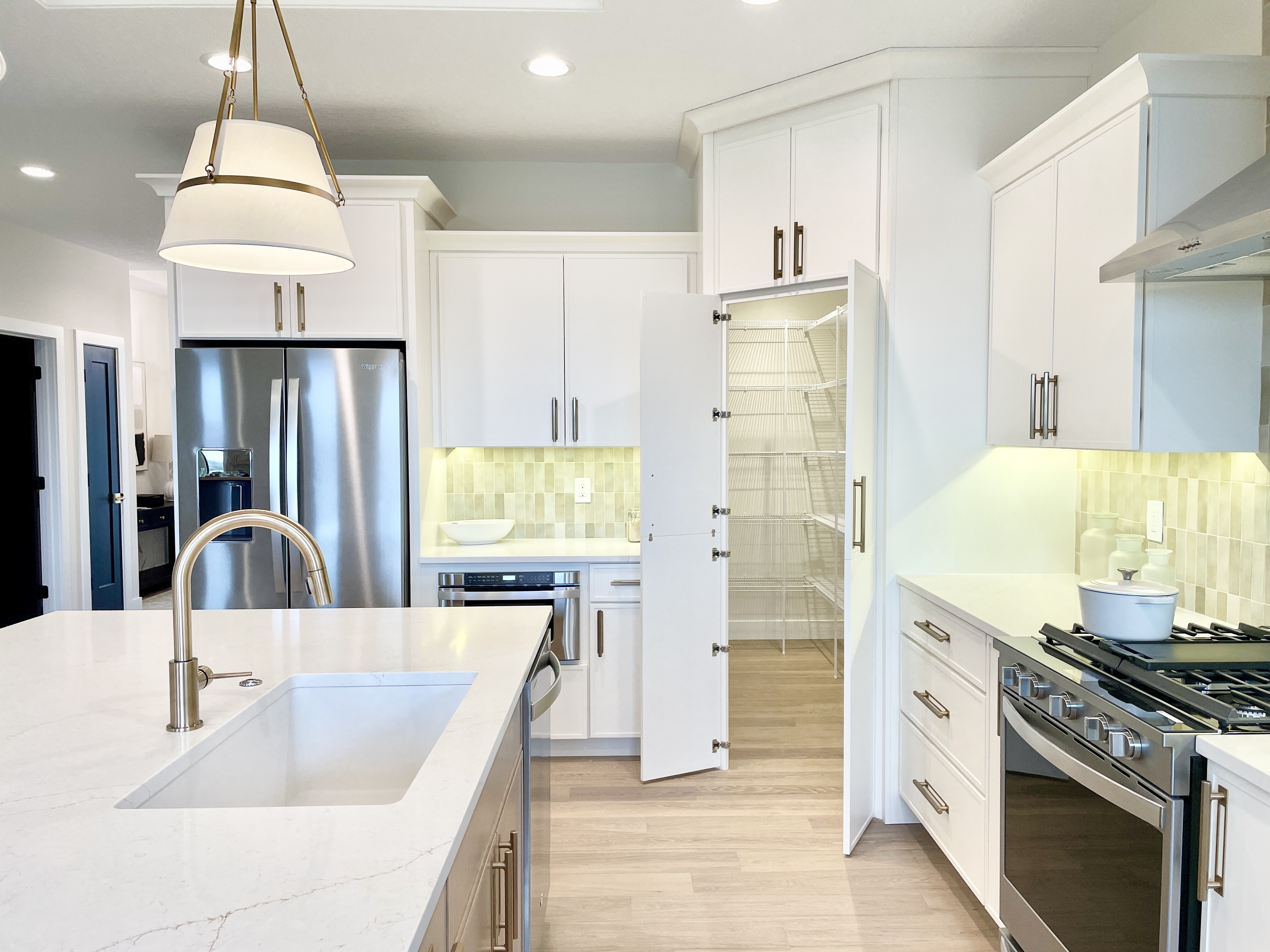 kitchen image with corner hidden pantry with doors open