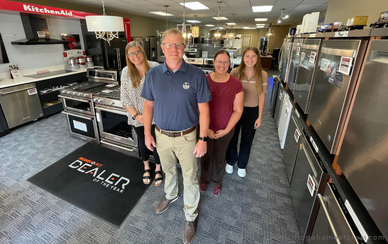 photo of appliance staff in village home stores showroom Rachele, rob, monica, and abby