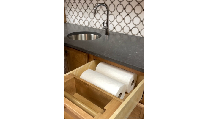 paper towel drawer with from dispense shown open with storage behind