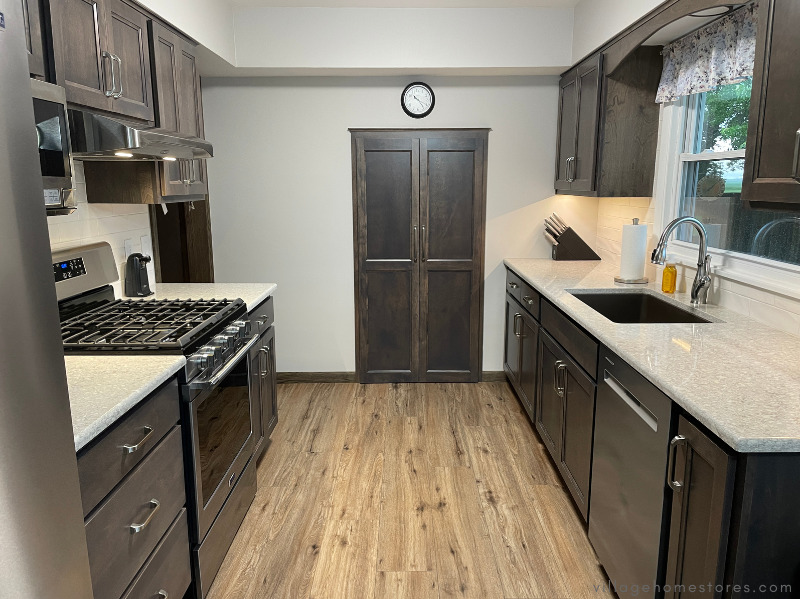 gray cabinet stained galley kitchen with quartz countertops