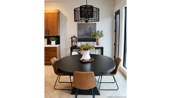 Jayna Crystorama woven black jute pendant hanging in a kitchen dining area