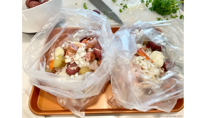 clear Reynolds oven bags full of cajun seafood boil ingredients