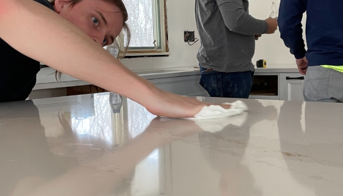 image of countertop installed wiping down new quartz counters