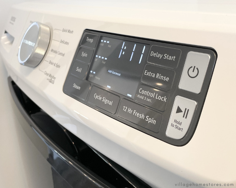 close up on maytag front load laundry controls with extra power button selected
