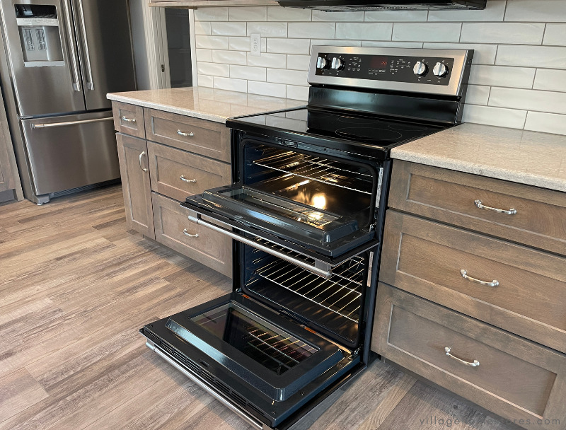  maytag double oven range with the two oven doors open