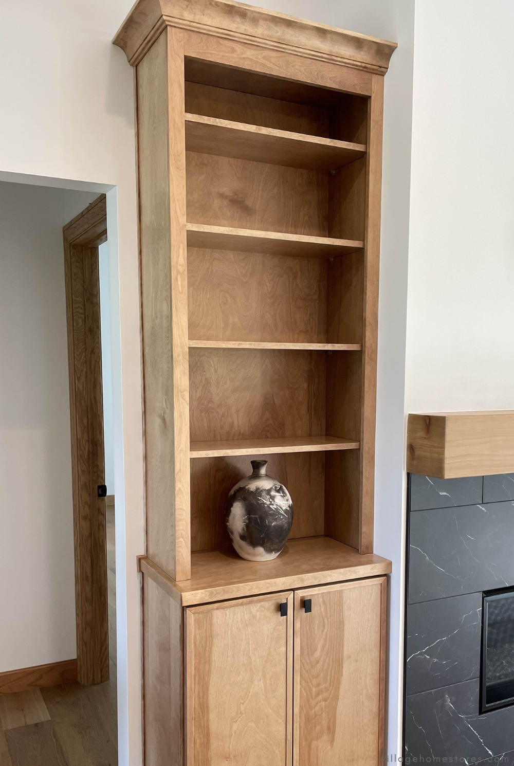 skinny shaker style cabinetry in birch wood and pecan stain for fireplace surround cabinets and open shelving