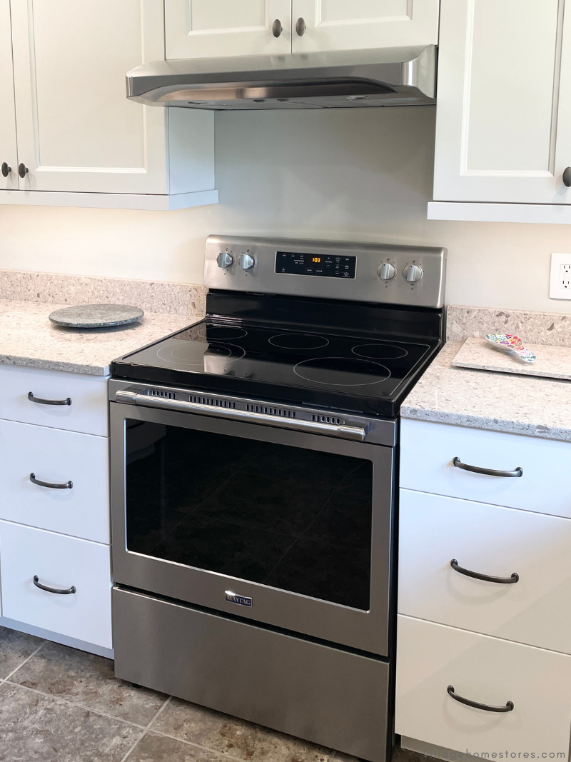 maytag electric range in stainless steel shown with under cabinet range hood from Village Home Stores