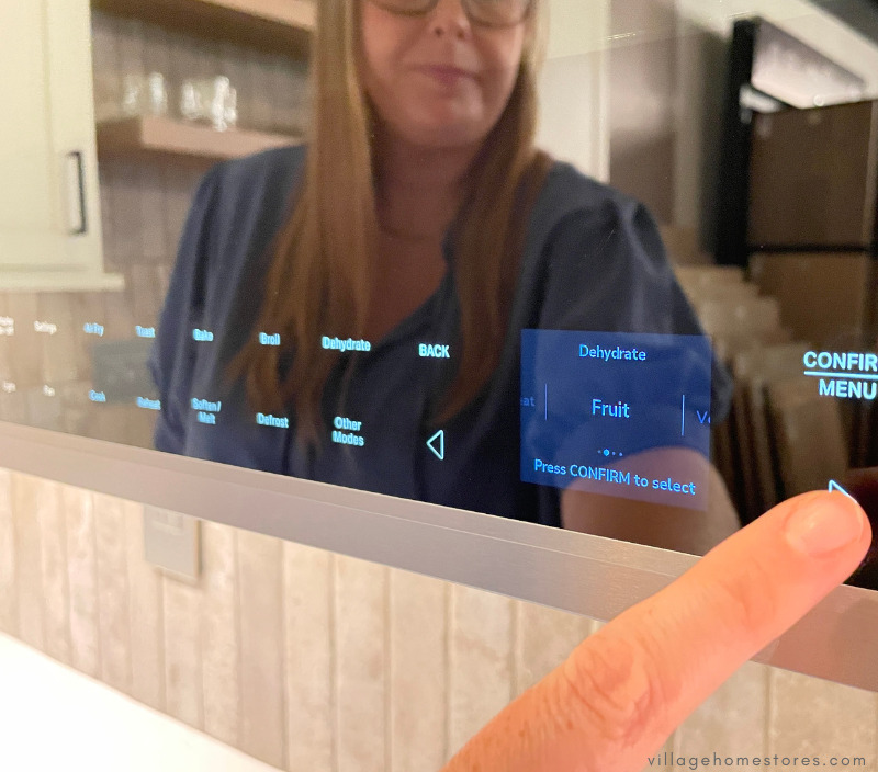 close up of otr microwave controls showing display and dehydrate option selected