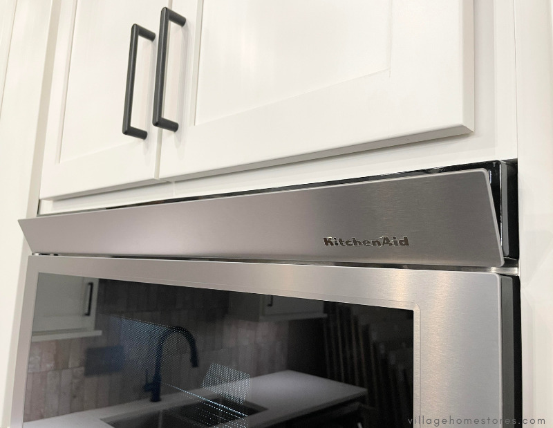 close up image of flush microwave hood with retractable vent popped out