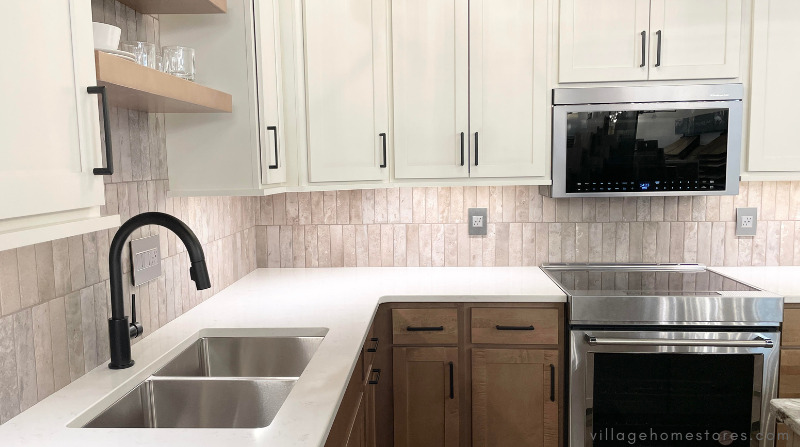 white and maple cabinet kitchen with stainless appliances and gray vertical backsplash wall tile