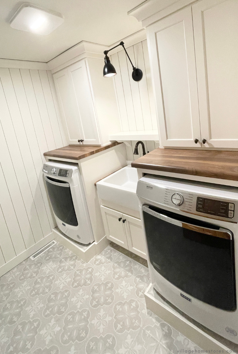 maytag front load washer and dryer and farmsink in middle