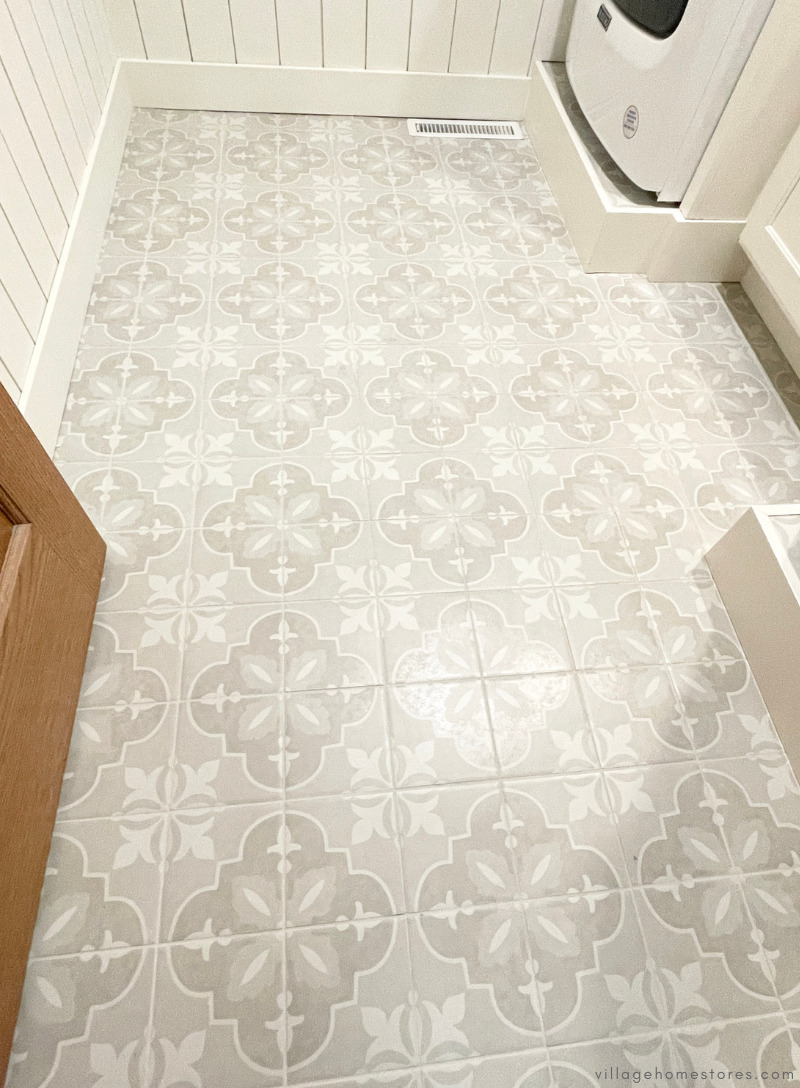 neutral farmhouse painted pattern tile installed as a laundry room floor