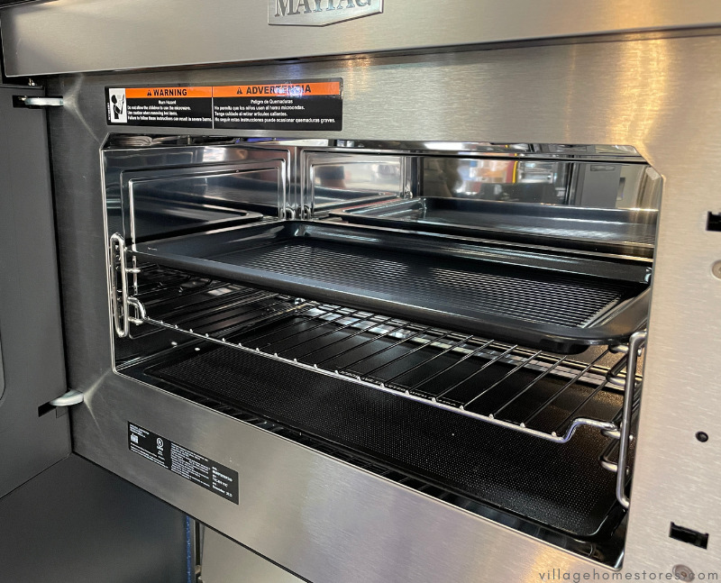 maytag microwave shown with door open and two racks inside