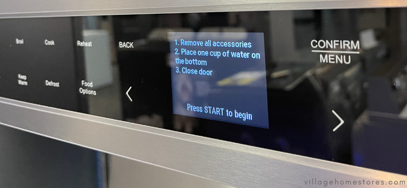 microwave control panel showing steam clean instruction steps
