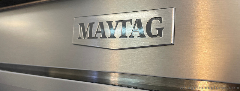 close up image of stainless steel panel with new stainless and chrome maytag badge