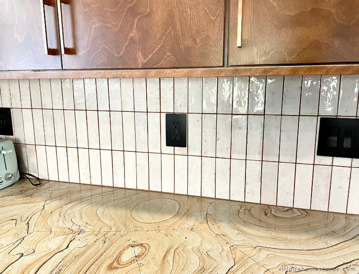 white glossy soldier vertical stack backsplash tile in kitchen
