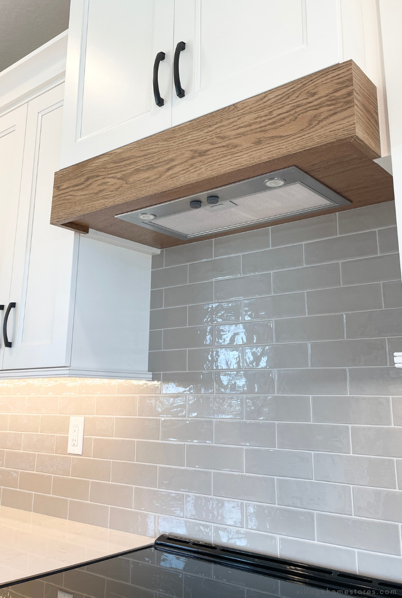 cabinet wood range hood in white with oak trim and with blower insert installed
