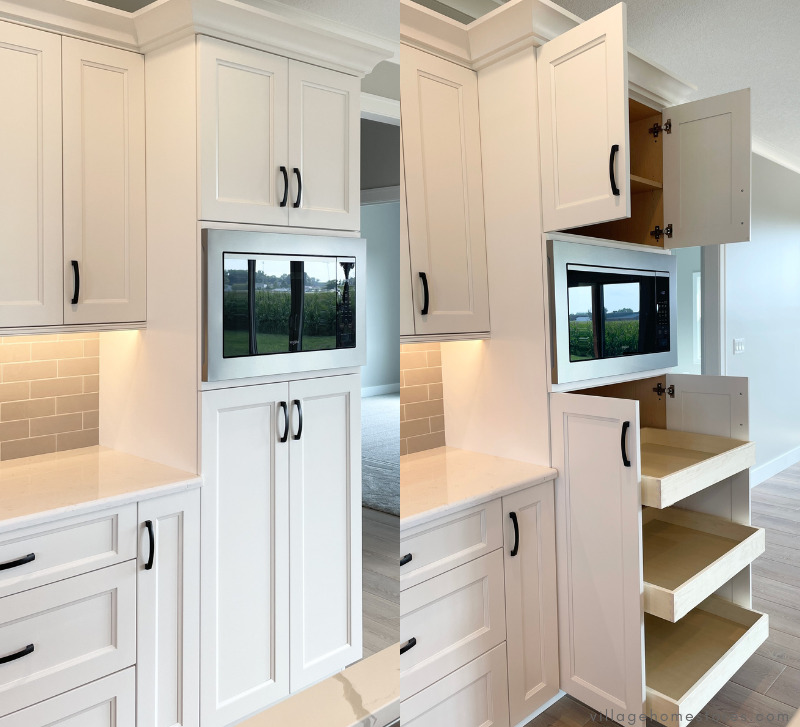 tall linen white cabinet with built in microwave installed in stainless steel