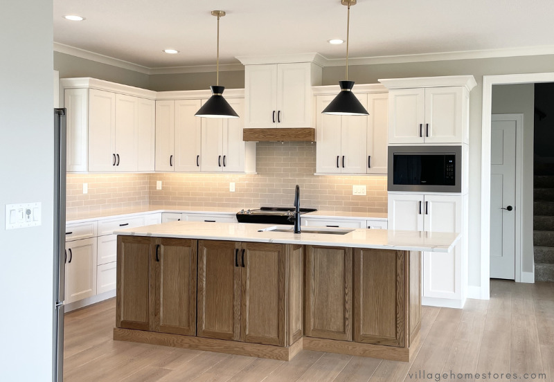 kitchen by village home stores with white oak kitchen island and pendant lighting