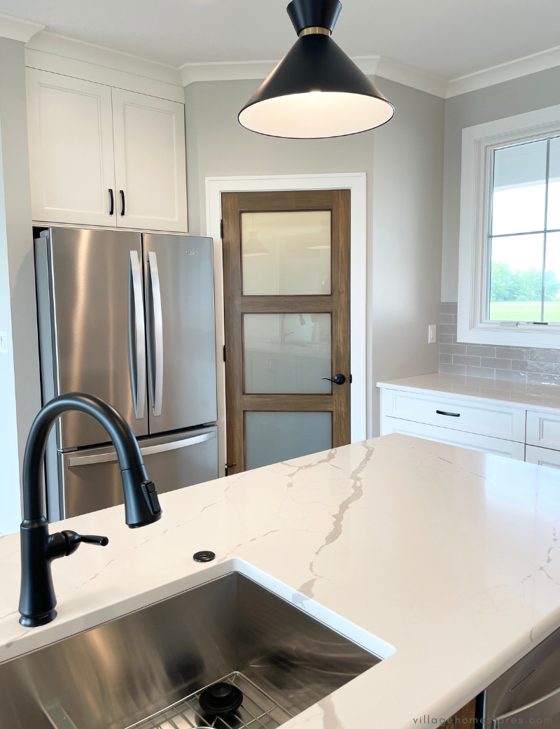 kitchen design with sink in island and corner pantry
