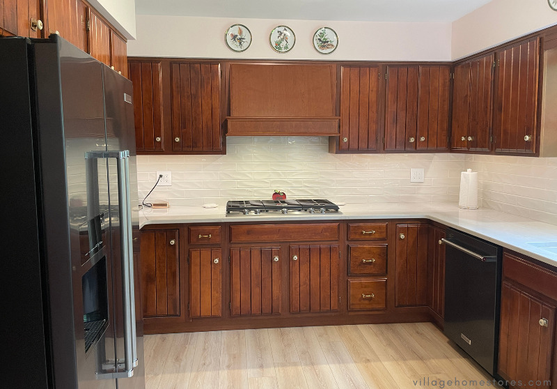 u shaped kitchen design with cherry cabinets and black stainless appliances