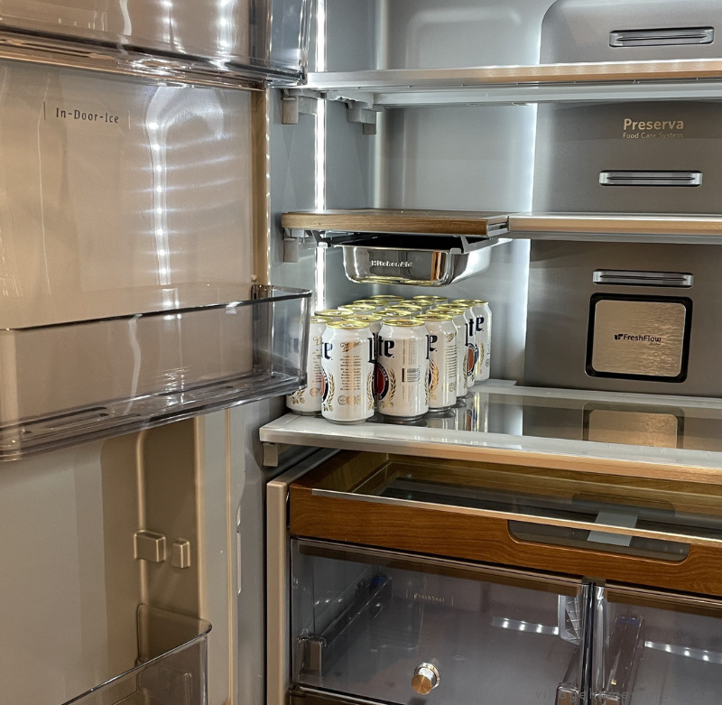 interior view of French door kitchenaid refrigerator with platinum interior and wood look accents