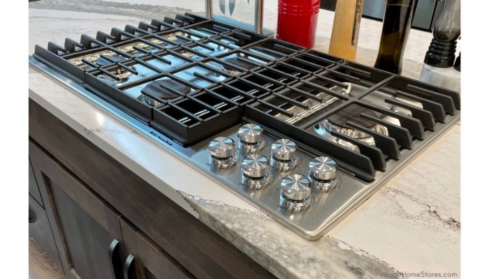 kitchenaid stainless gas 5 burner downdraft cooktop installed in quartz countertop
