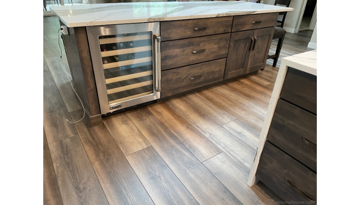 interior view of kitchen island cabinets and glass door beverage cooler