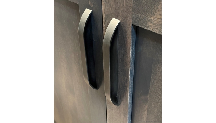 elara series handle hardware installed on gray stained cabinet doors