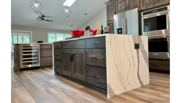 kitchen island with wrap around waterfall counters and two islands in view
