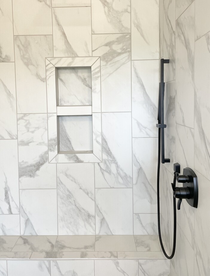 recessed tiled shower niche shelf with tile and Schluter products from village home stores