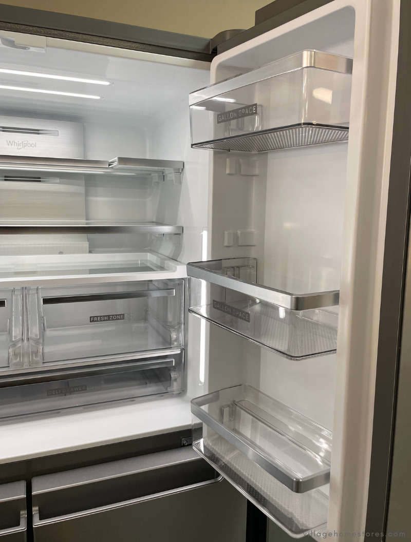 inside of refrigerator with gallon door bins