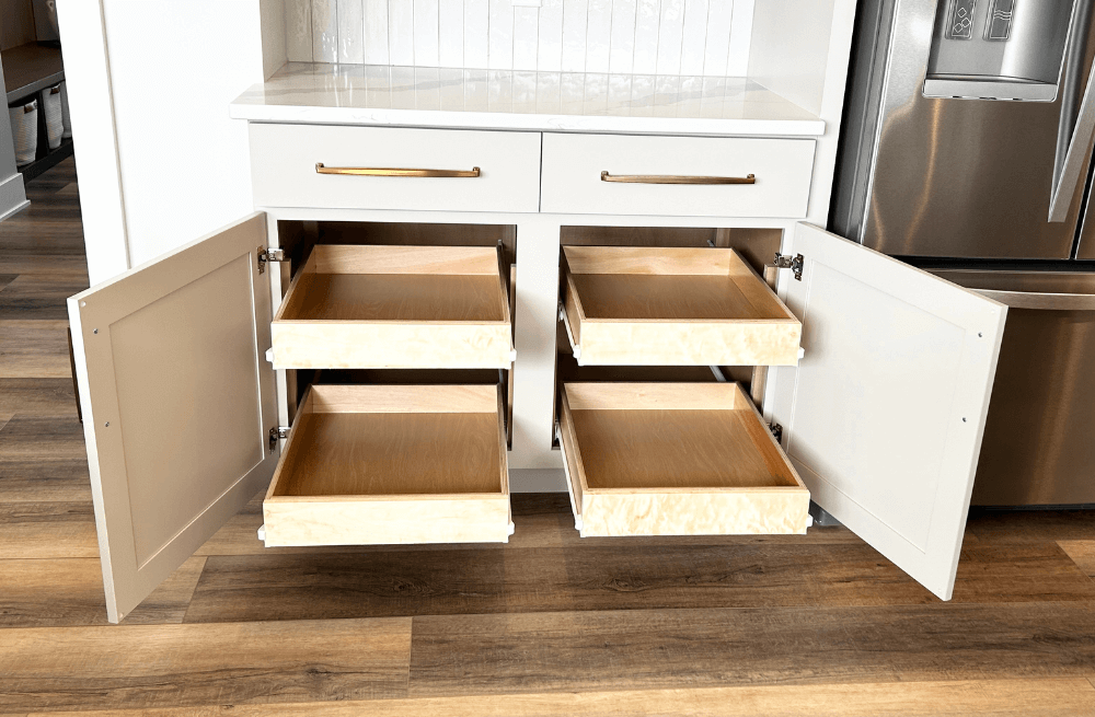 base kitchen cabinets shown with doors open and sliding shelves