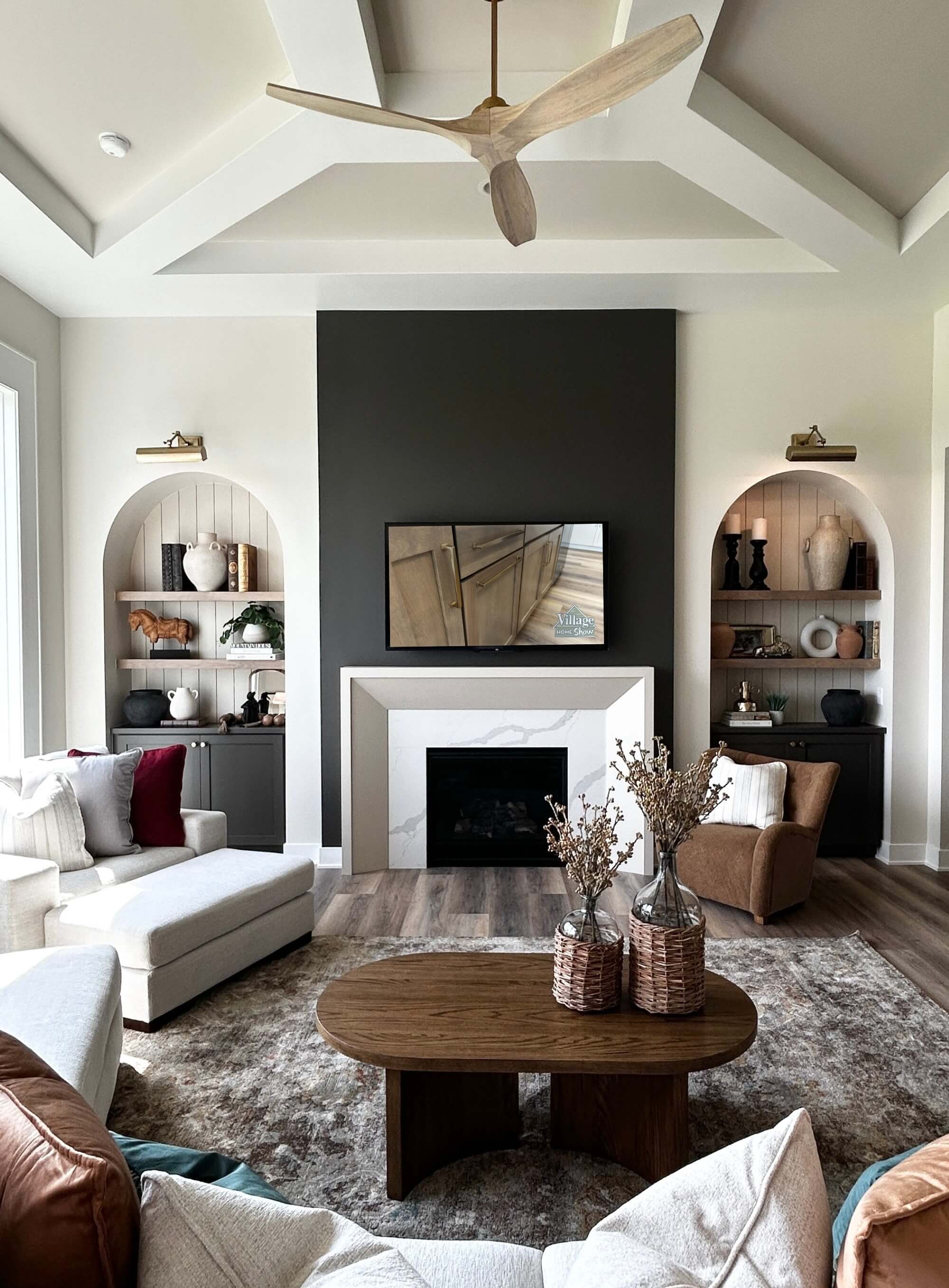 great room with white oak fan arched niches and fireplace