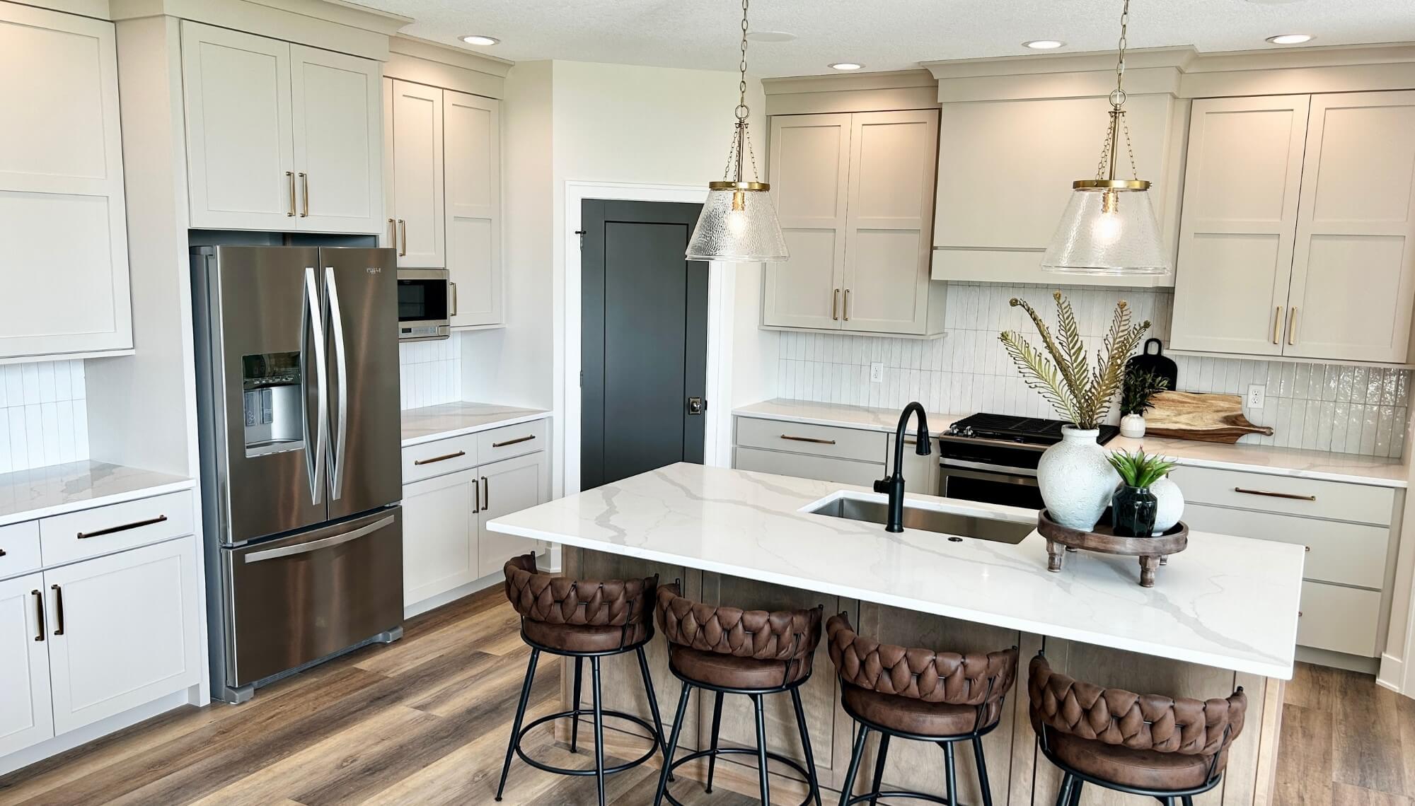 quad cities kitchen design by Village Home Stores with kitchen island at the center
