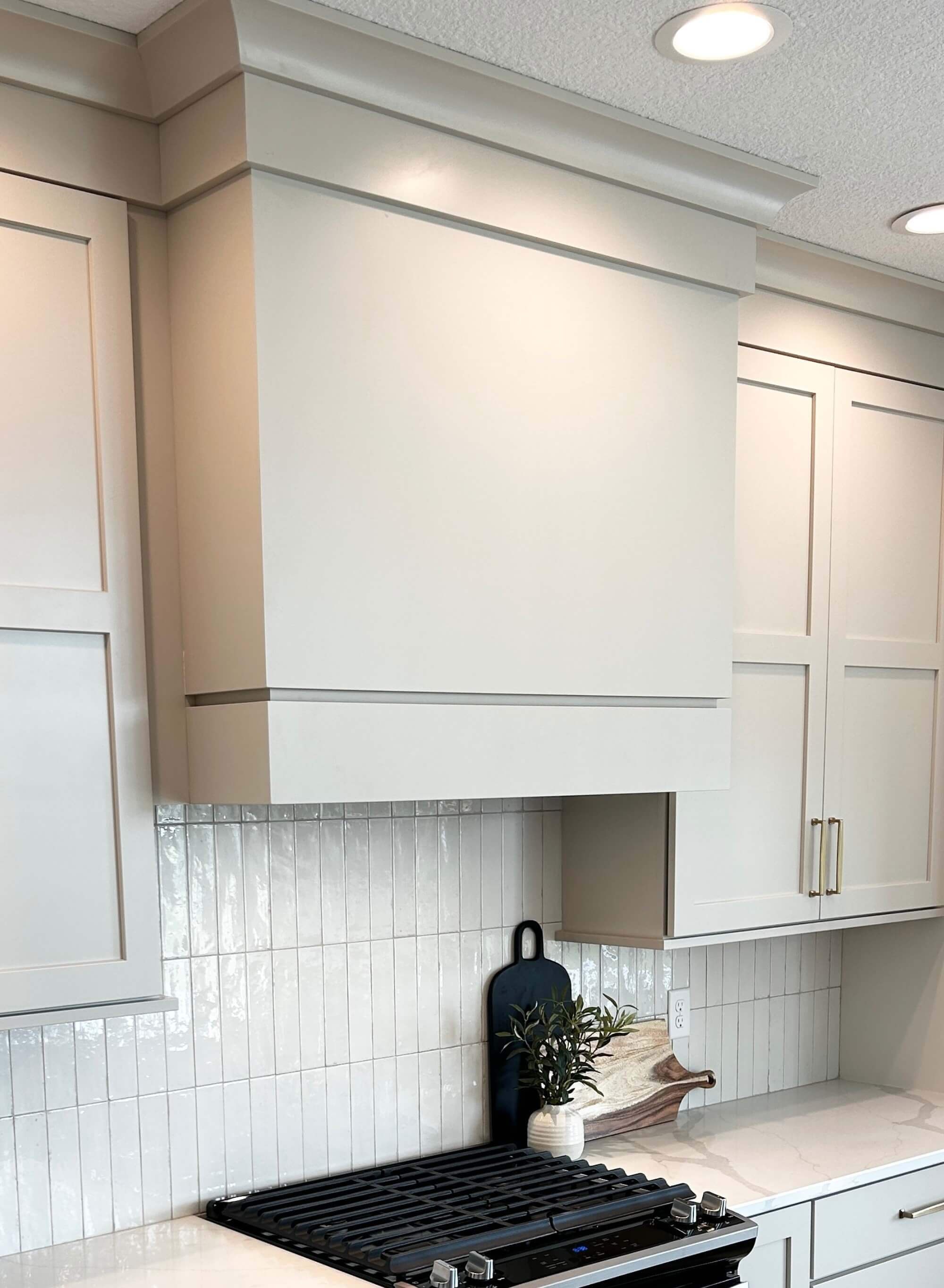 wood rangehood cabinet painted in accessible beige