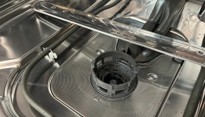 interior floor of stainless steel tub dishwasher with filter in place