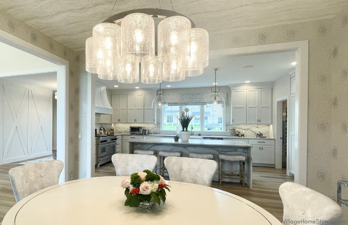 view of kitchen from dining room with chandelier in top of image