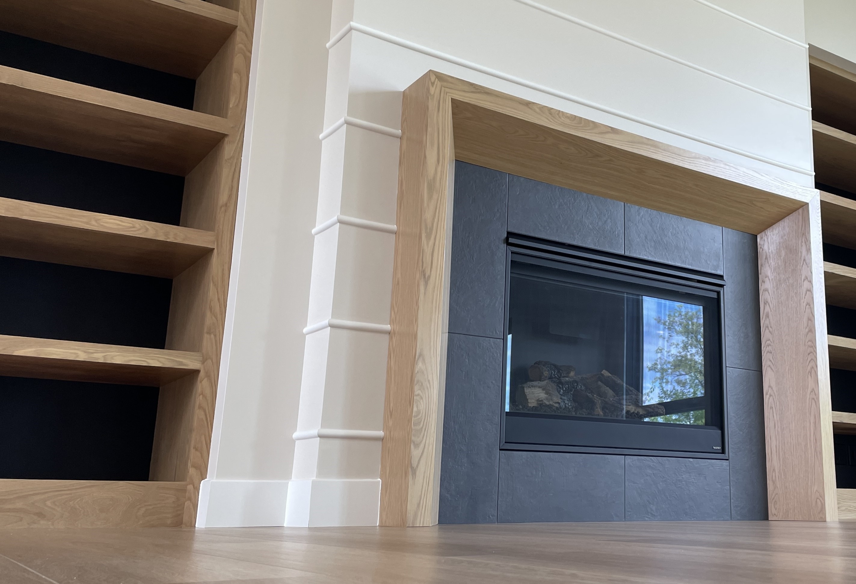 black fireplace surround tile with minimalist modern wood mantle