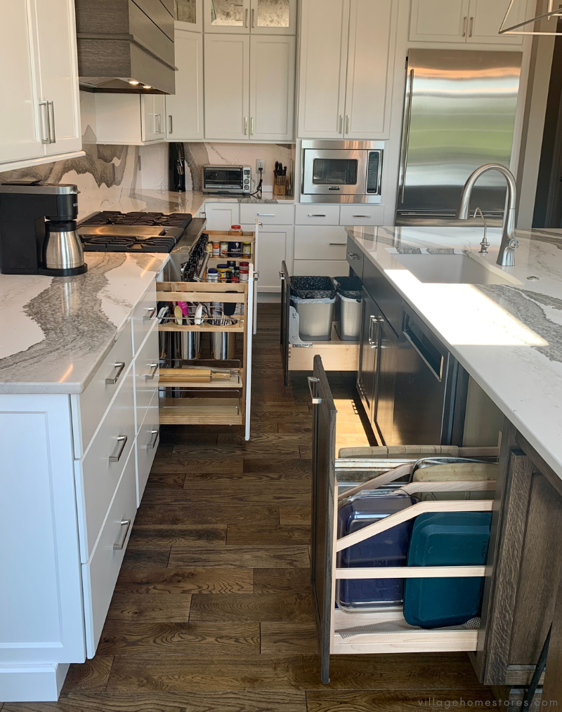 kitchen with many storage cabinets shown open 