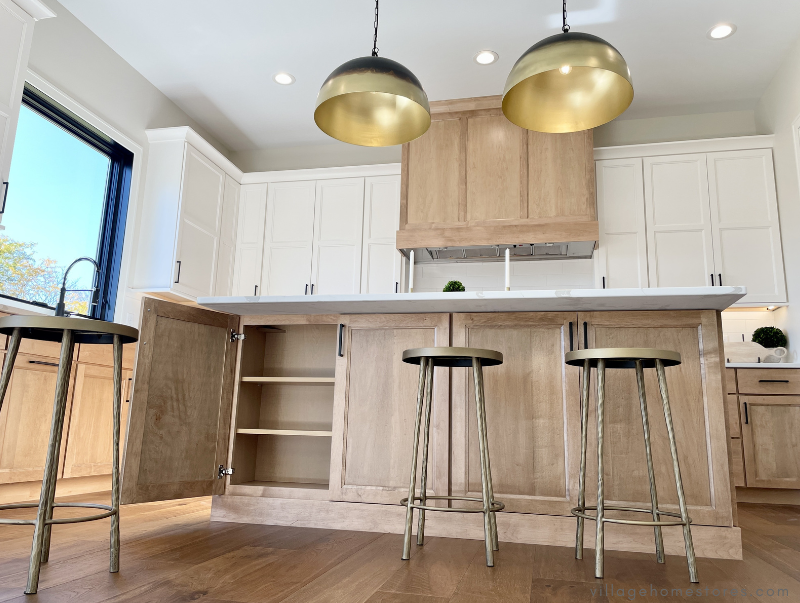 maple kitchen island design shown with cabinet door open on back of island